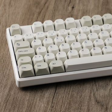 Azerty Keycaps Vintage Gris sur une table